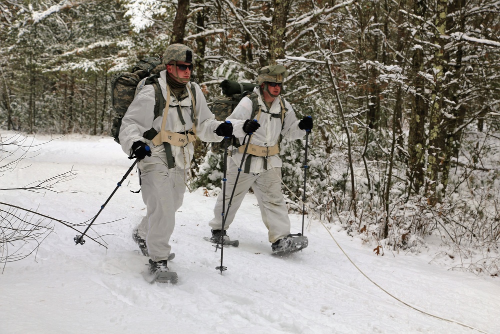 Cold-Weather Operations Course Class 18-06 students practice snowshoeing at Fort McCoy