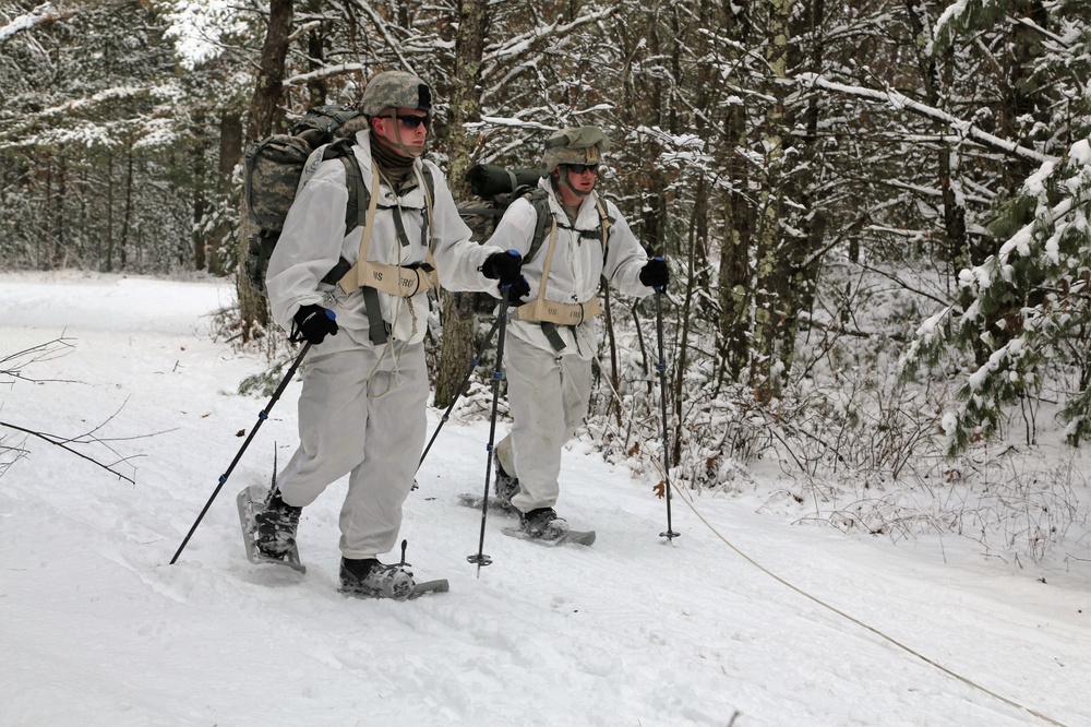 Cold-Weather Operations Course Class 18-06 students practice snowshoeing at Fort McCoy