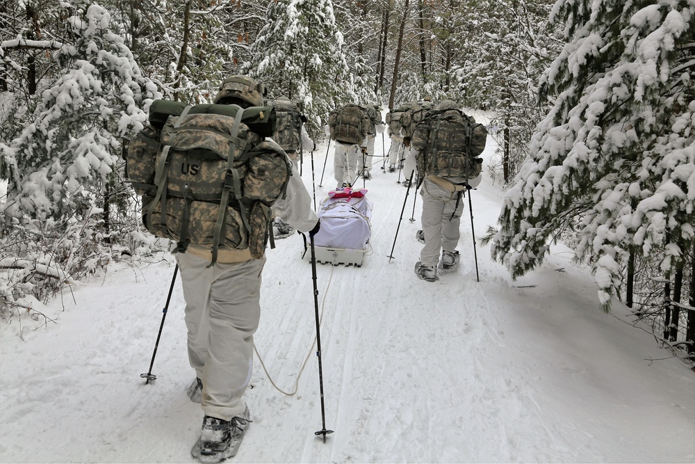 Cold-Weather Operations Course Class 18-06 students practice snowshoeing at Fort McCoy