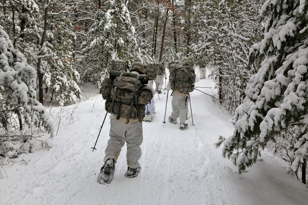 Cold-Weather Operations Course Class 18-06 students practice snowshoeing at Fort McCoy