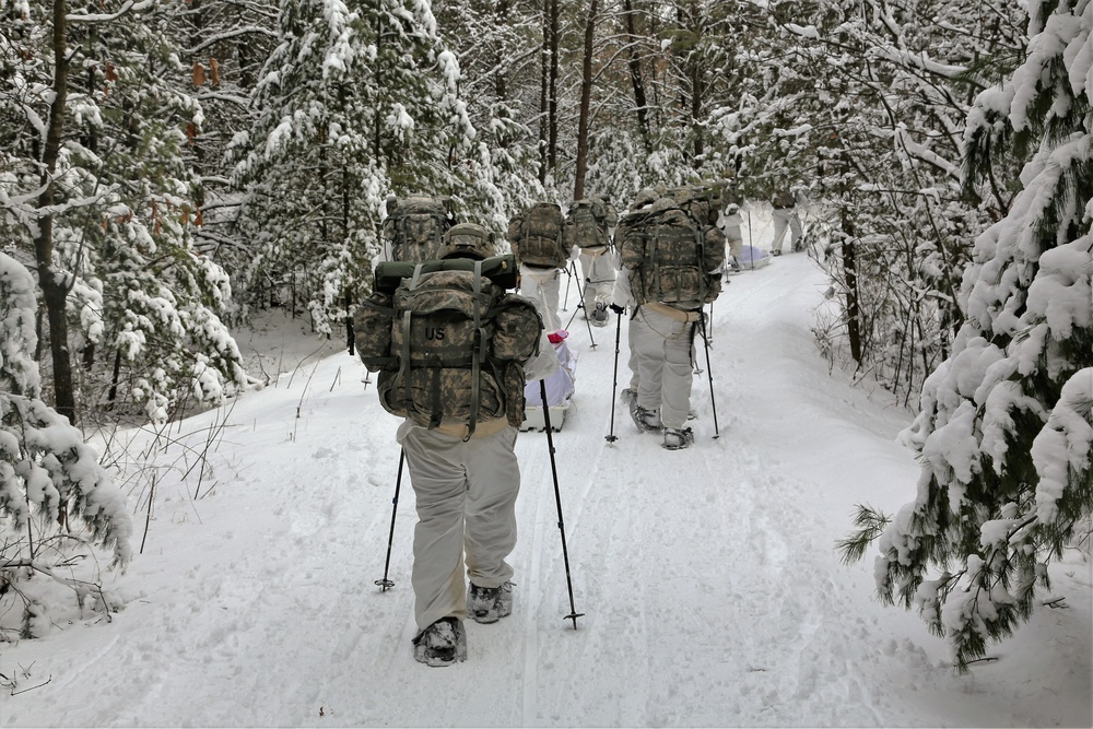 Cold-Weather Operations Course Class 18-06 students practice snowshoeing at Fort McCoy