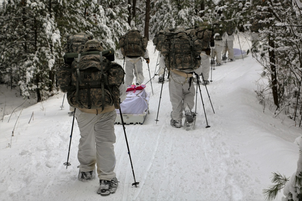 Cold-Weather Operations Course Class 18-06 students practice snowshoeing at Fort McCoy