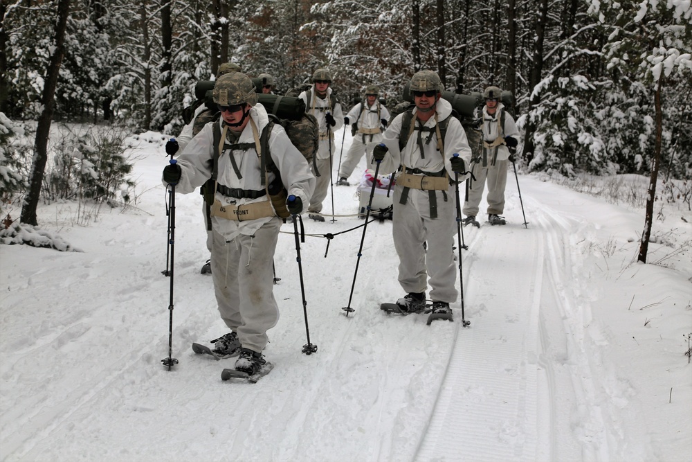 Cold-Weather Operations Course Class 18-06 students practice snowshoeing at Fort McCoy