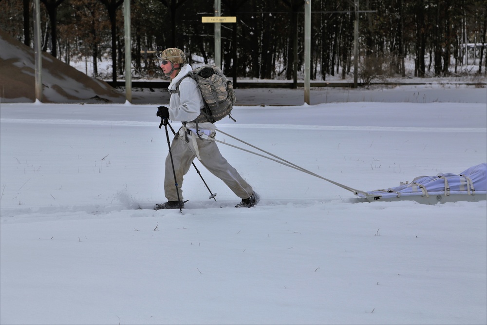 Cold-Weather Operations Course Class 18-06 students practice snowshoeing at Fort McCoy