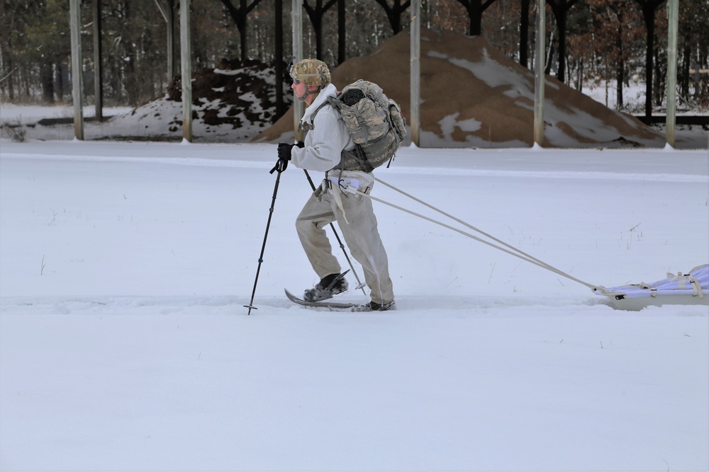 Cold-Weather Operations Course Class 18-06 students practice snowshoeing at Fort McCoy