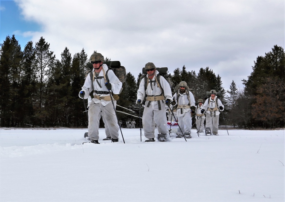 Cold-Weather Operations Course Class 18-06 students practice snowshoeing at Fort McCoy