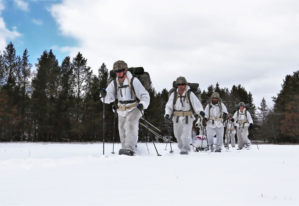 Cold-Weather Operations Course Class 18-06 students practice snowshoeing at Fort McCoy