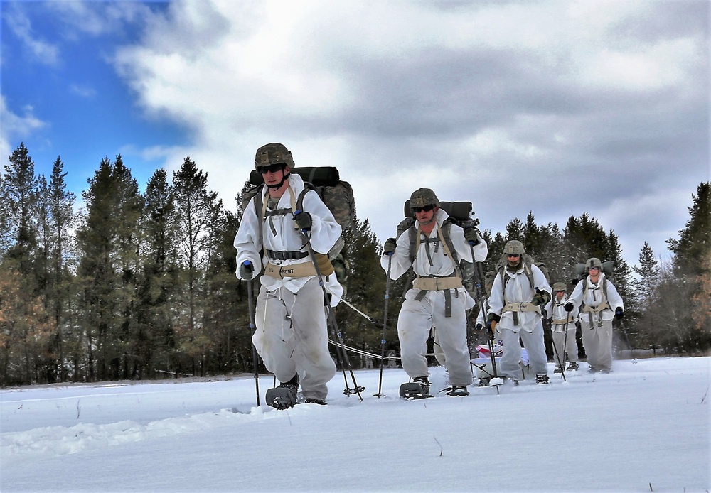 Cold-Weather Operations Course Class 18-06 students practice snowshoeing at Fort McCoy