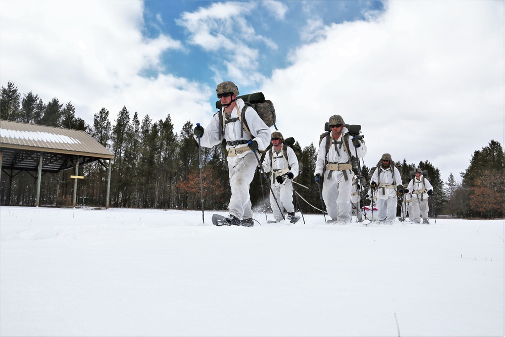 Cold-Weather Operations Course Class 18-06 students practice snowshoeing at Fort McCoy