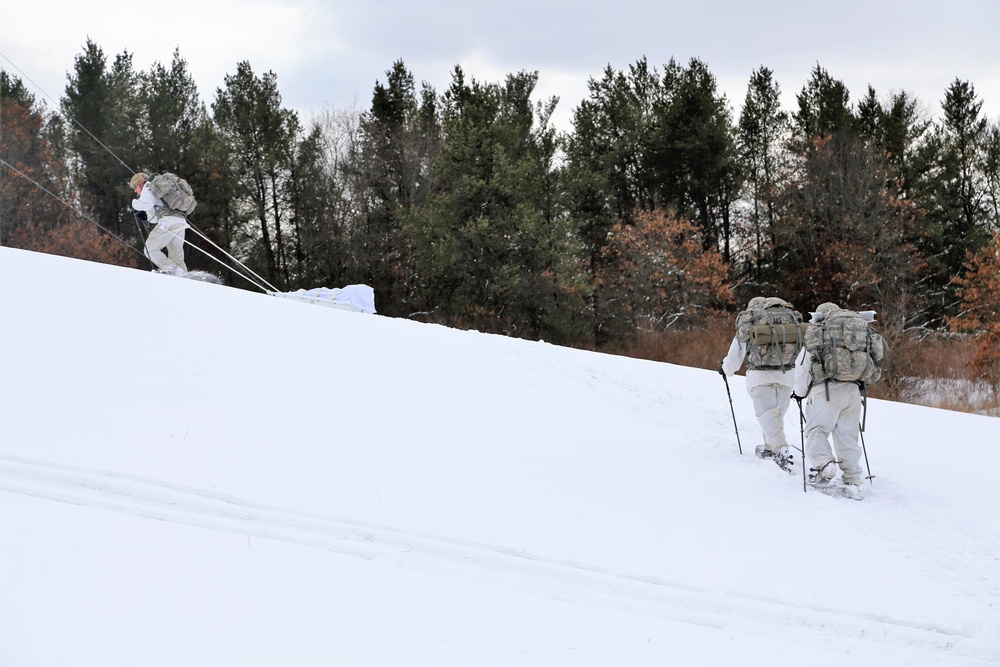 Cold-Weather Operations Course Class 18-06 students practice snowshoeing at Fort McCoy