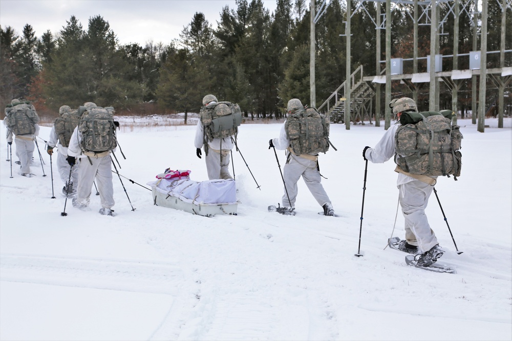 Cold-Weather Operations Course Class 18-06 students practice snowshoeing at Fort McCoy