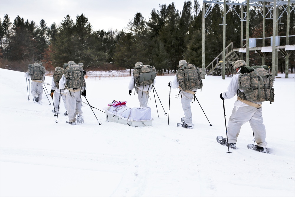 Cold-Weather Operations Course Class 18-06 students practice snowshoeing at Fort McCoy