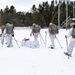 Cold-Weather Operations Course Class 18-06 students practice snowshoeing at Fort McCoy