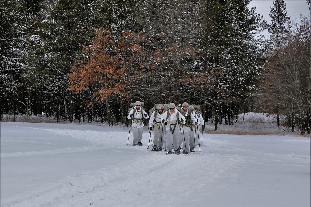 Cold-Weather Operations Course Class 18-06 students practice snowshoeing at Fort McCoy