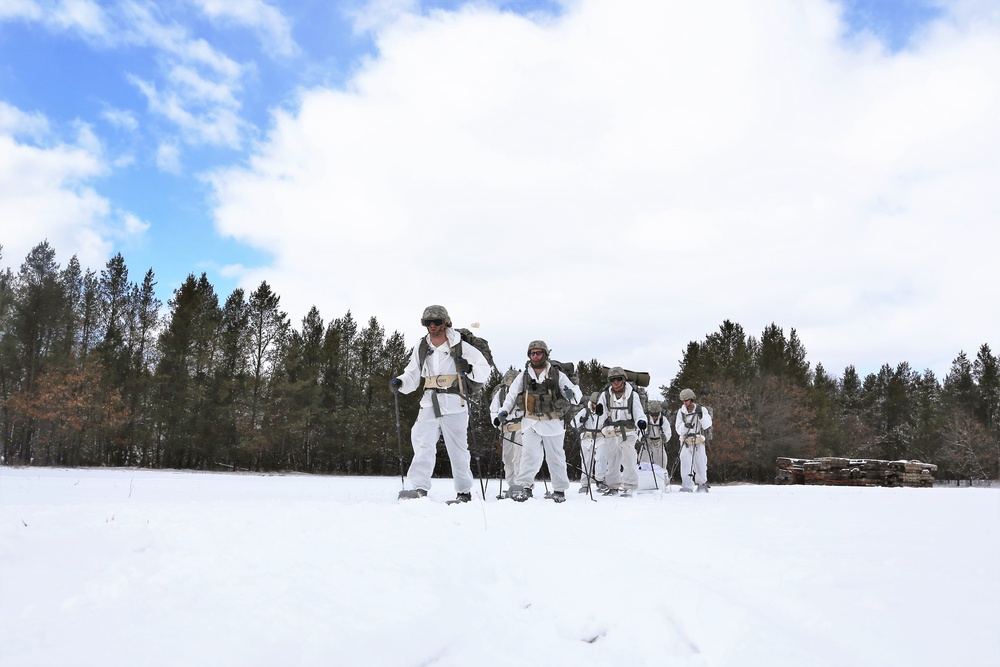 Cold-Weather Operations Course Class 18-06 students practice snowshoeing at Fort McCoy