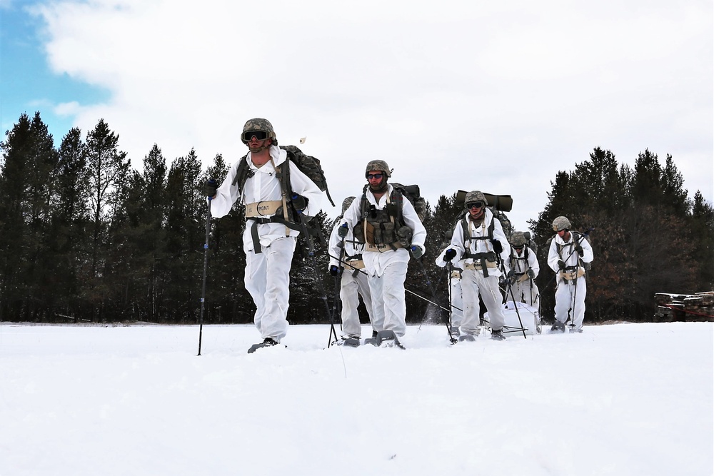 Cold-Weather Operations Course Class 18-06 students practice snowshoeing at Fort McCoy