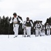 Cold-Weather Operations Course Class 18-06 students practice snowshoeing at Fort McCoy