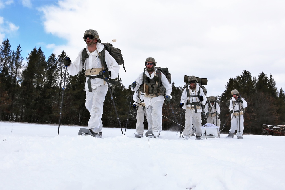 Cold-Weather Operations Course Class 18-06 students practice snowshoeing at Fort McCoy