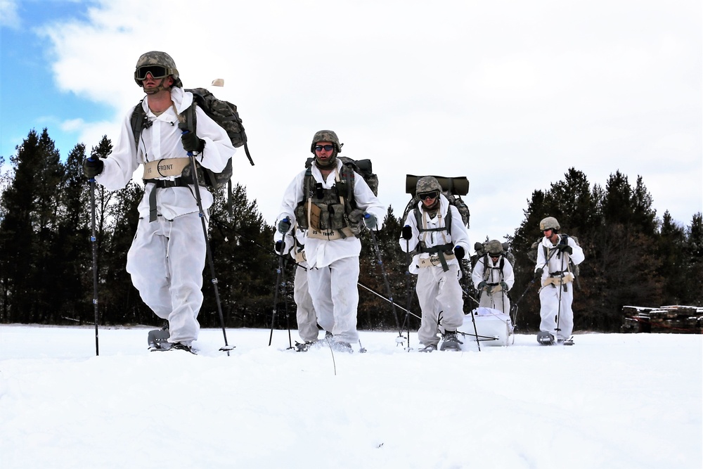 Cold-Weather Operations Course Class 18-06 students practice snowshoeing at Fort McCoy