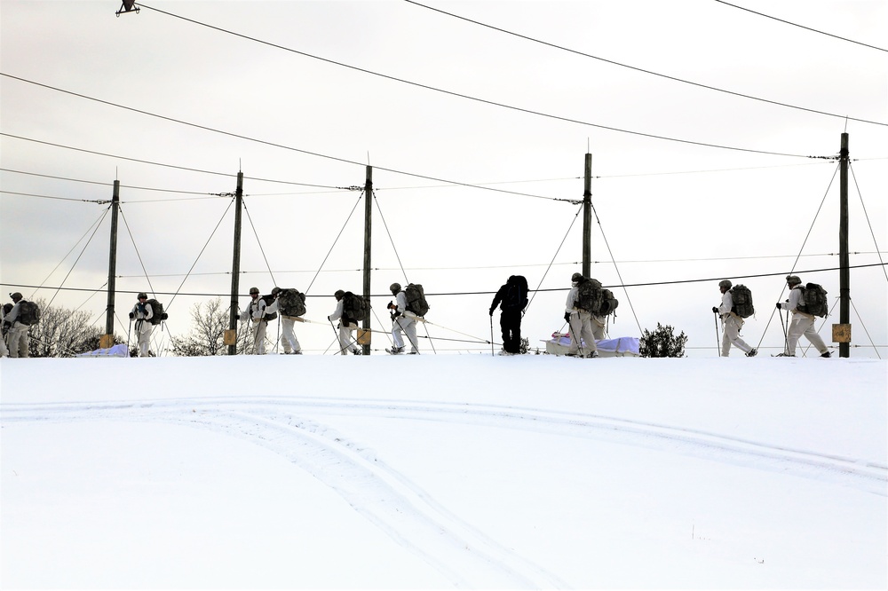 Cold-Weather Operations Course Class 18-06 students practice snowshoeing at Fort McCoy