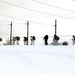 Cold-Weather Operations Course Class 18-06 students practice snowshoeing at Fort McCoy