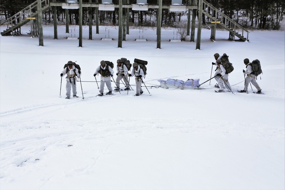 Cold-Weather Operations Course Class 18-06 students practice snowshoeing at Fort McCoy