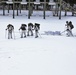 Cold-Weather Operations Course Class 18-06 students practice snowshoeing at Fort McCoy