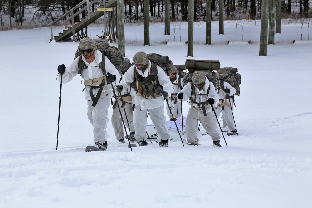 Cold-Weather Operations Course Class 18-06 students practice snowshoeing at Fort McCoy