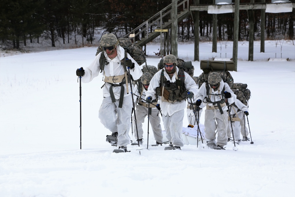 Cold-Weather Operations Course Class 18-06 students practice snowshoeing at Fort McCoy