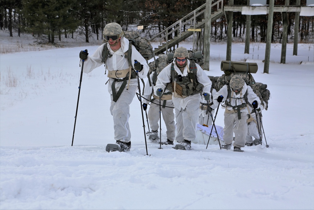 Cold-Weather Operations Course Class 18-06 students practice snowshoeing at Fort McCoy