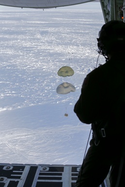 Alaska National Guard C-130J drops equipment, personnel to frozen Beaufort Sea