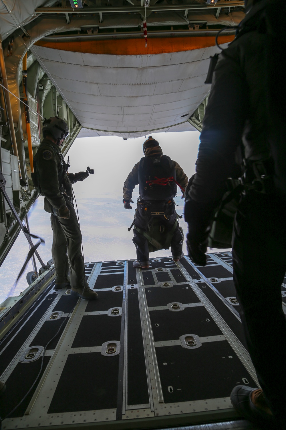 Alaska National Guard C-130J drops equipment, personnel to frozen Beaufort Sea