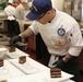 Petty Officer First Class John Jefferies from the United States Coast Guard Culinary Team preps his Chef of the Year dish