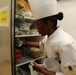 Pvt. Naya Pender U.S. Army Europe Culinary Team assists her lead Chef by dry storage preparations