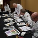 ACF Judges test and critique deserts menu items during Chef of the Year exercise at the Joint Culinary Center of Excellence