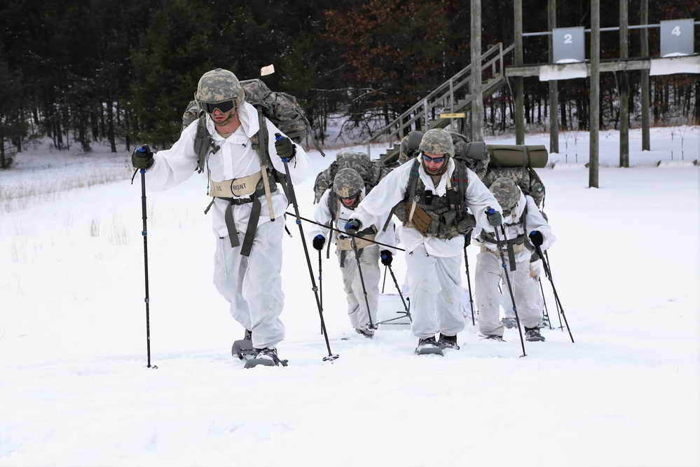 Cold-Weather Operations Course Class 18-06 students practice snowshoeing at Fort McCoy