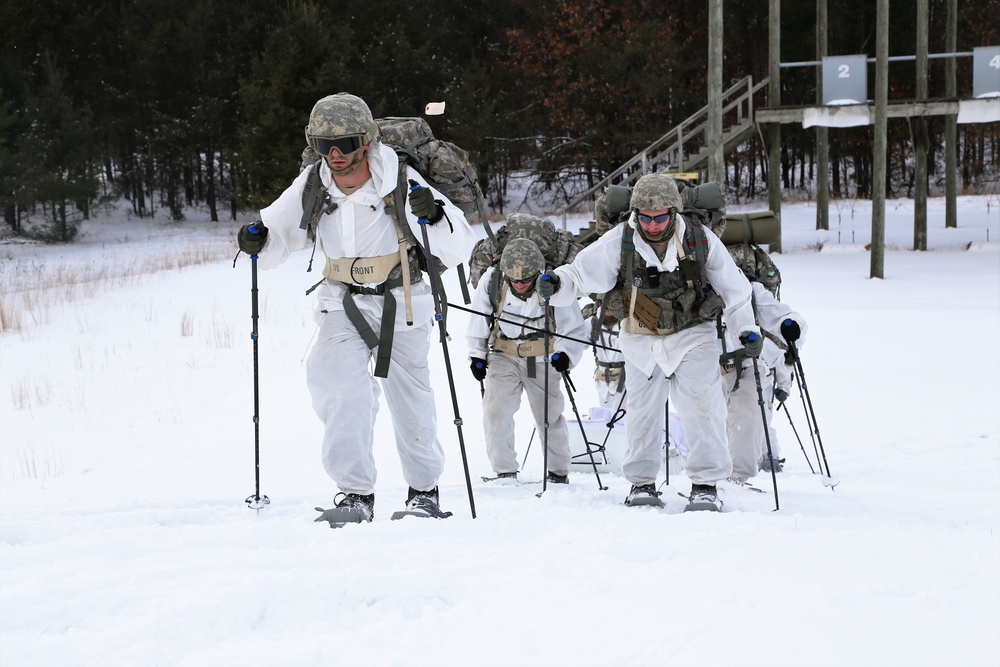 Cold-Weather Operations Course Class 18-06 students practice snowshoeing at Fort McCoy