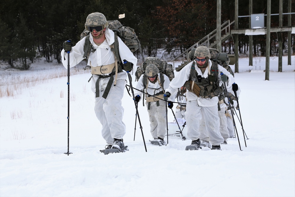 Cold-Weather Operations Course Class 18-06 students practice snowshoeing at Fort McCoy