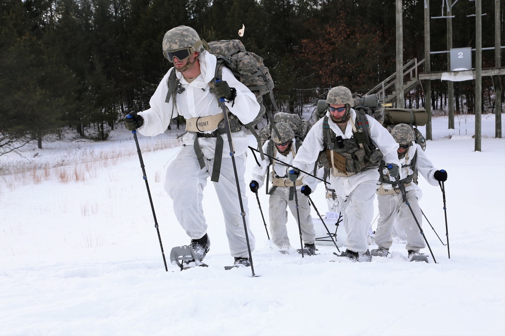 Cold-Weather Operations Course Class 18-06 students practice snowshoeing at Fort McCoy