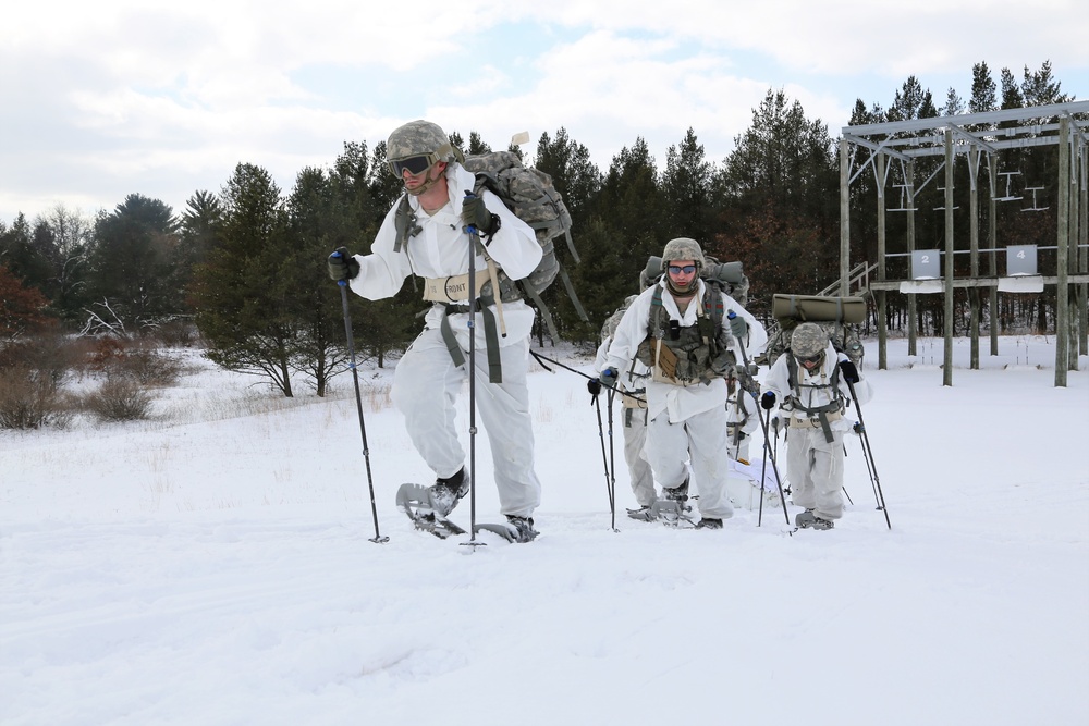 Cold-Weather Operations Course Class 18-06 students practice snowshoeing at Fort McCoy