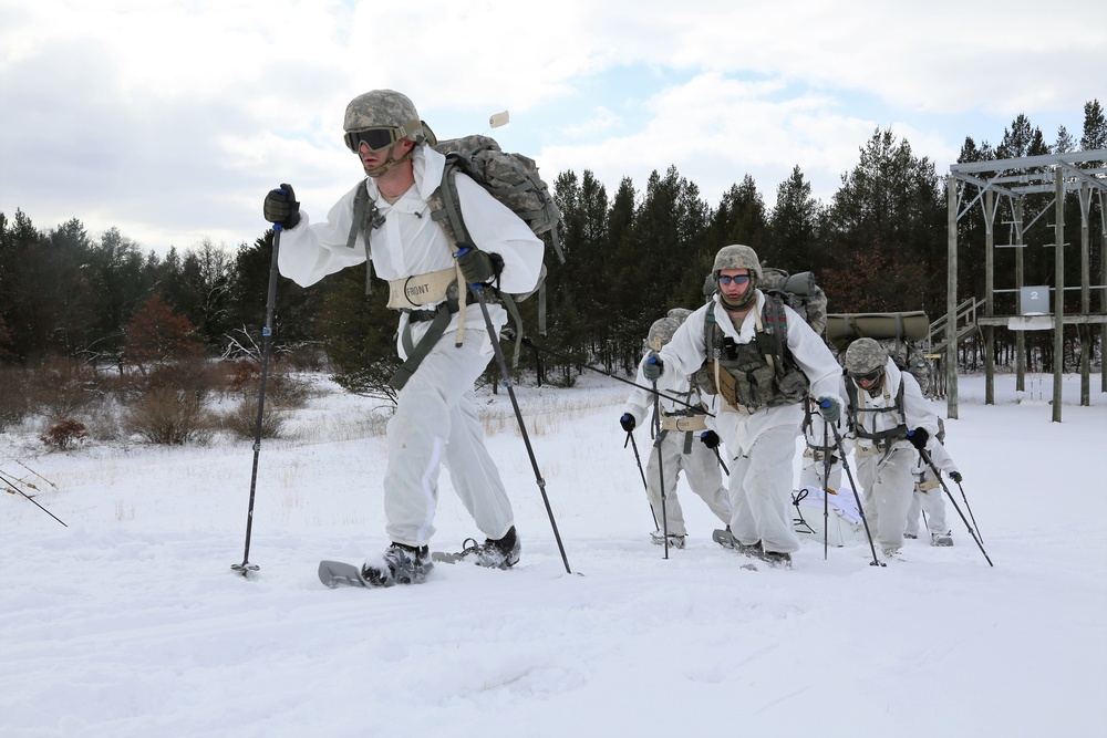 Cold-Weather Operations Course Class 18-06 students practice snowshoeing at Fort McCoy