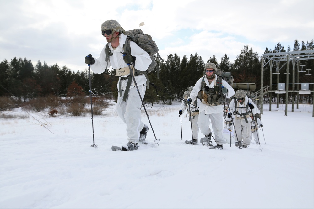 Cold-Weather Operations Course Class 18-06 students practice snowshoeing at Fort McCoy