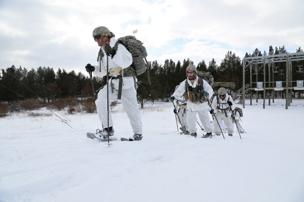 Cold-Weather Operations Course Class 18-06 students practice snowshoeing at Fort McCoy