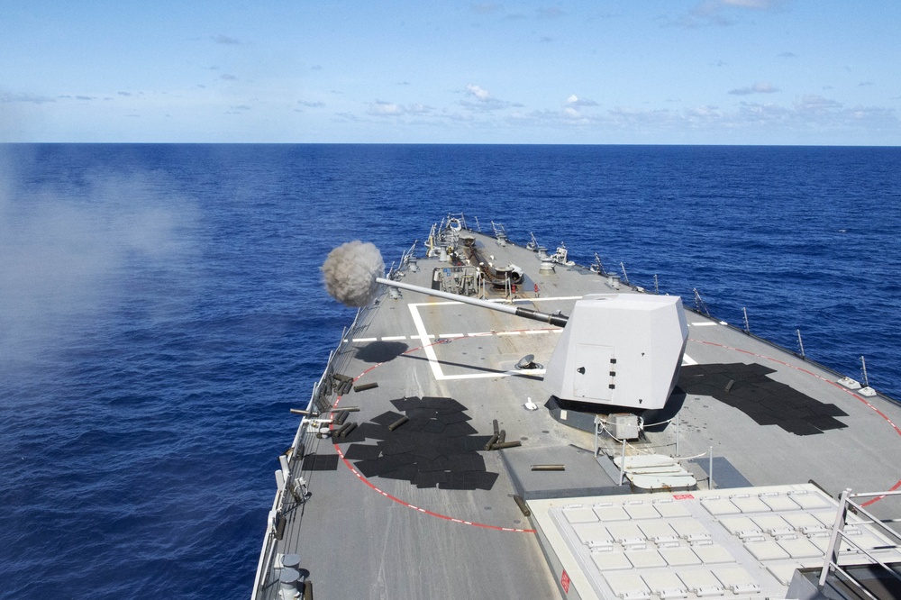 USS Mustin (DDG 89) fires the 5-inch gun during MultiSail 18
