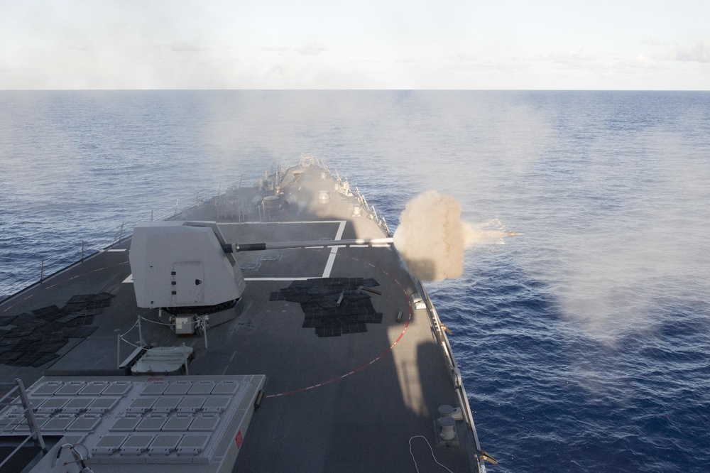 USS Mustin (DDG 89) fires the 5-inch gun during MultiSail 18