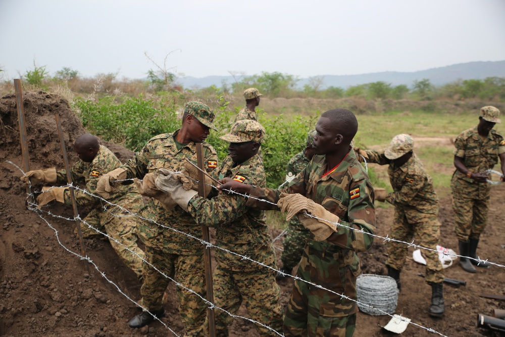 SPMAGTF-CR-AF service members train UPDF soldiers