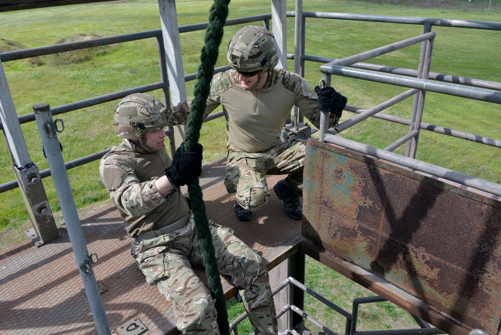 British Royal Marine commandos fast rope with SPMAGTF-CR-AF Marines