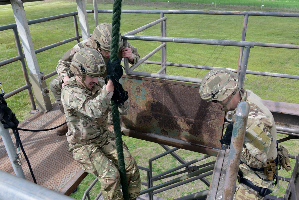 British Royal Marine commandos fast rope with SPMAGTF-CR-AF Marines