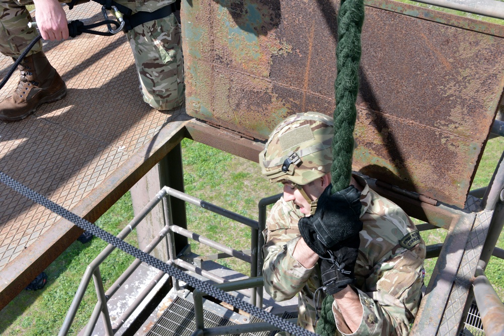 British Royal Marine commandos fast rope with SPMAGTF-CR-AF Marines