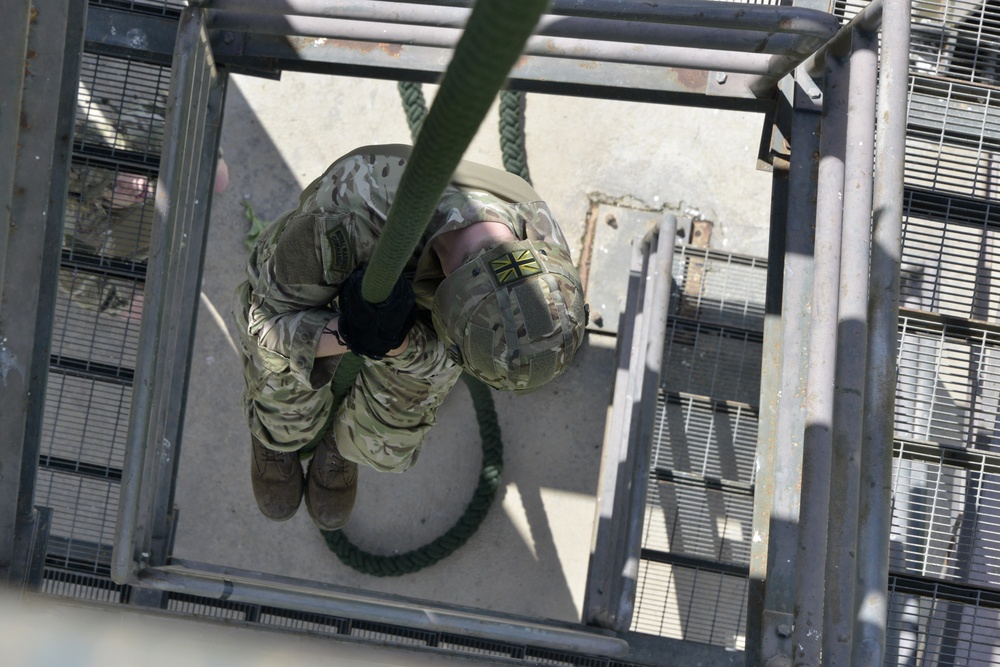 British Royal Marine commandos fast rope with SPMAGTF-CR-AF Marines